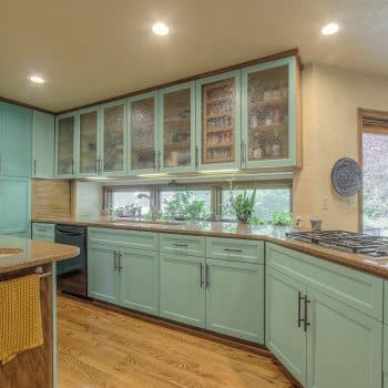 cabinets with green color in kitchen