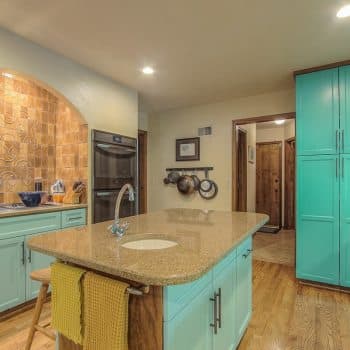 bright green cabinets and island in kitchen