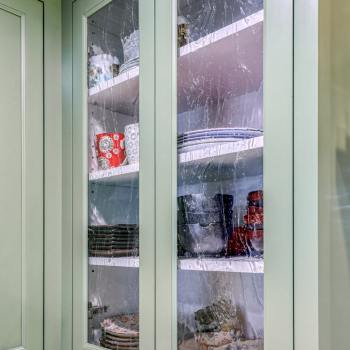 green cabinets with glass front