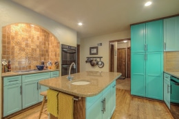 bright green cabinets and island in kitchen