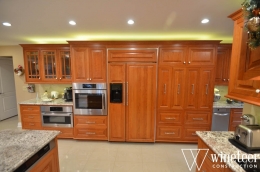 wooden cabinets in kitchen at home