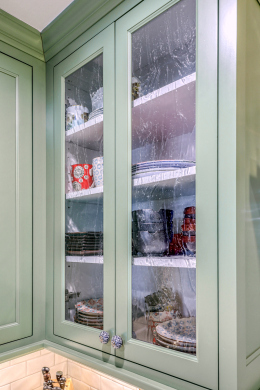 green cabinets with glass front