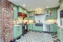 eccentric brick and green kitchen