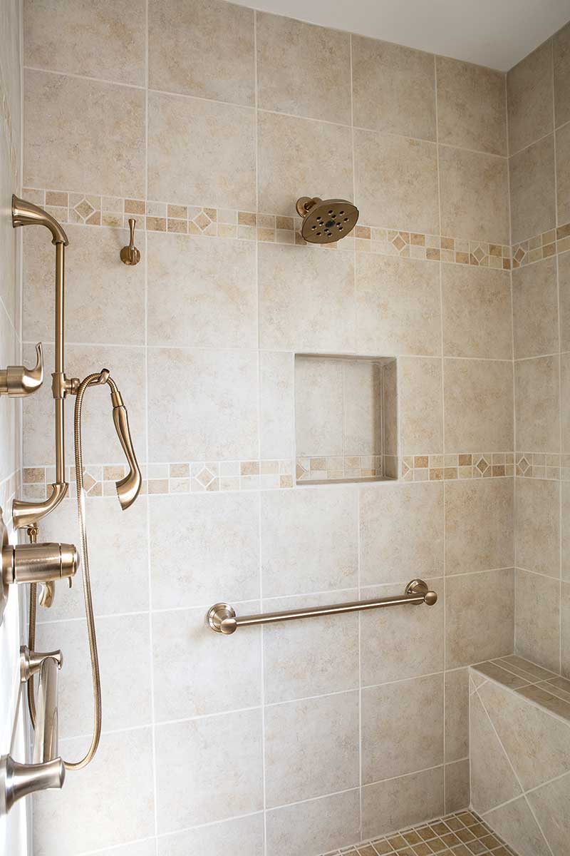 barrier free shower with gold accents