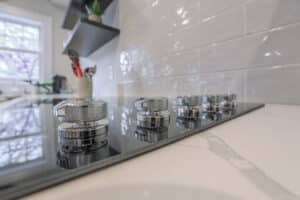 marble countertop with white subway backsplash tile and range