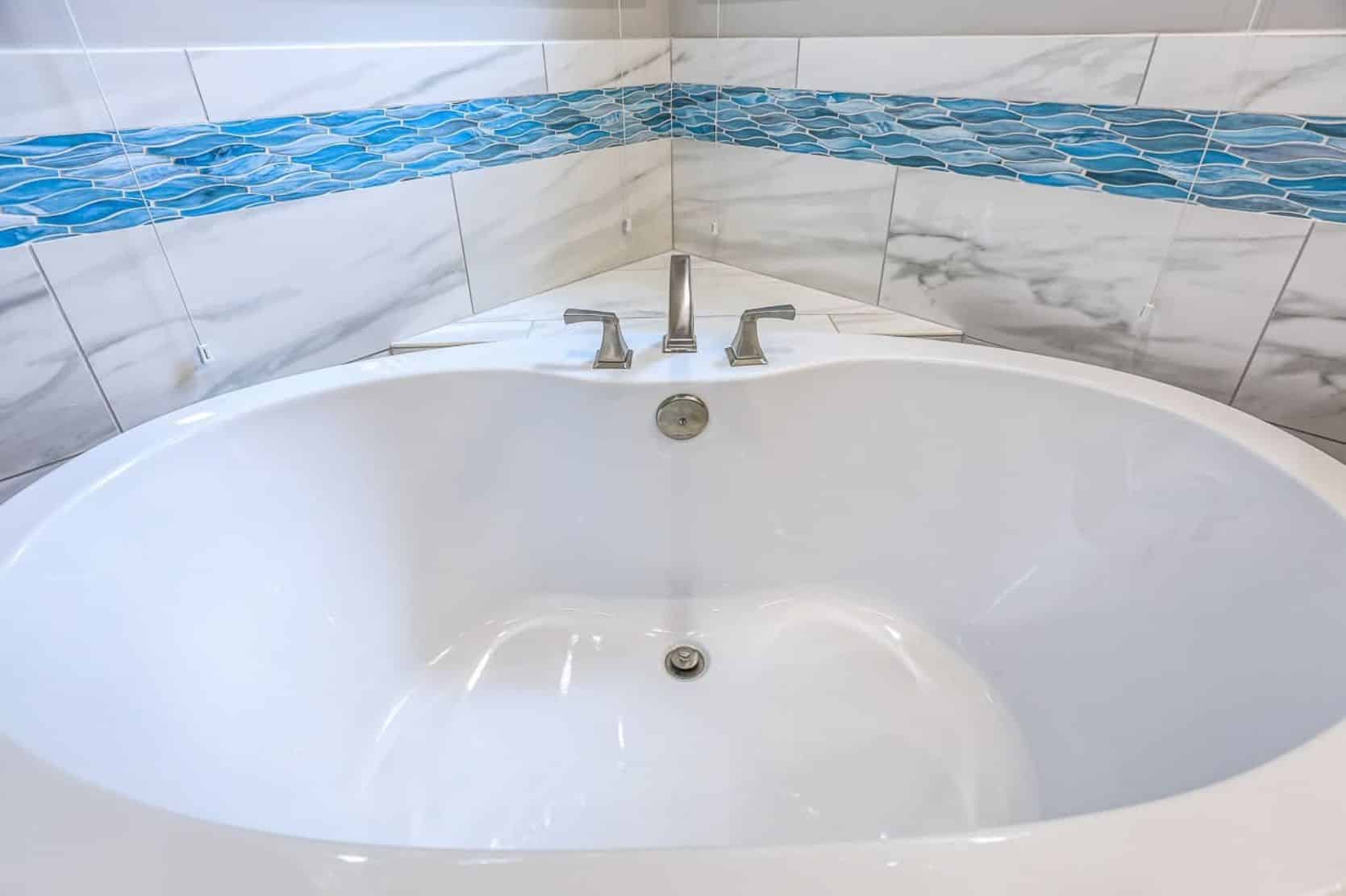 bathtub with blue tile detail
