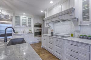 kitchen renovation with white cabinets and dark hardware