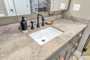 bathroom countertop with matte black faucet