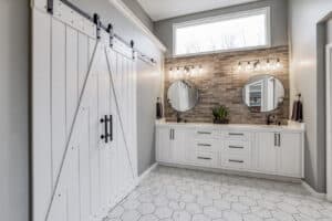 master bathroom vanity area with barn doors