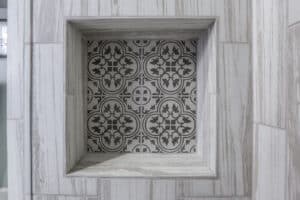 close-up of intricate tile pattern in the shower caddy