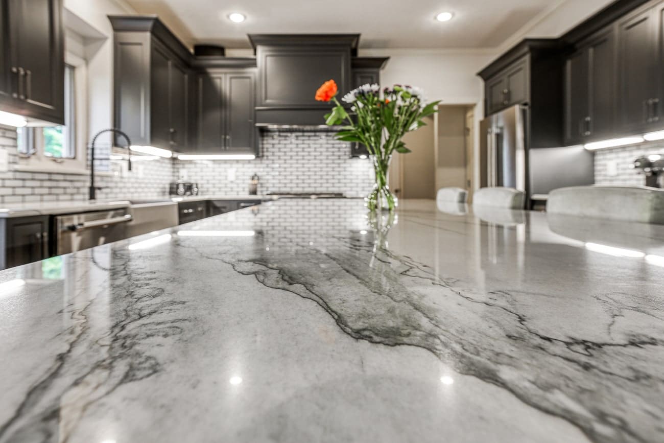 kitchen countertop with vase of flowers